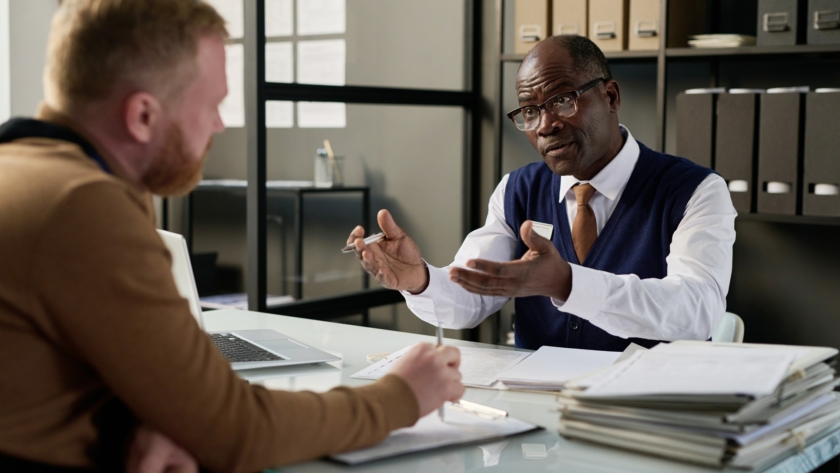 Attorney consulting client in office