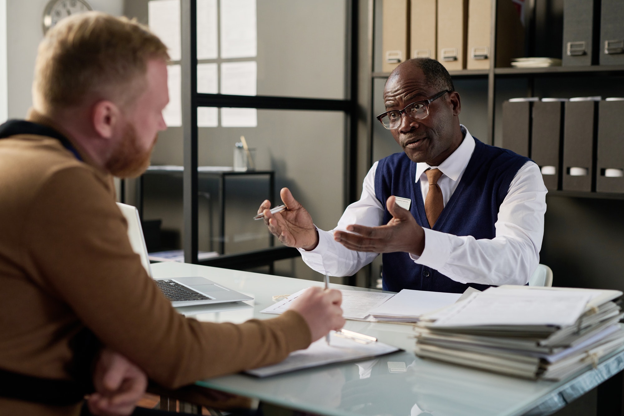 Attorney consulting client in office